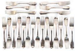 A collection of Victorian and later silver table forks, fiddle pattern, various makers and ages,