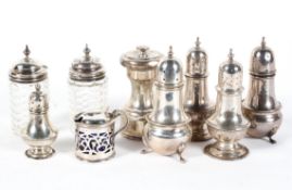 A collection of silver salt and pepper shakers and other items,