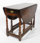 An 18th century oak gate leg dining table,