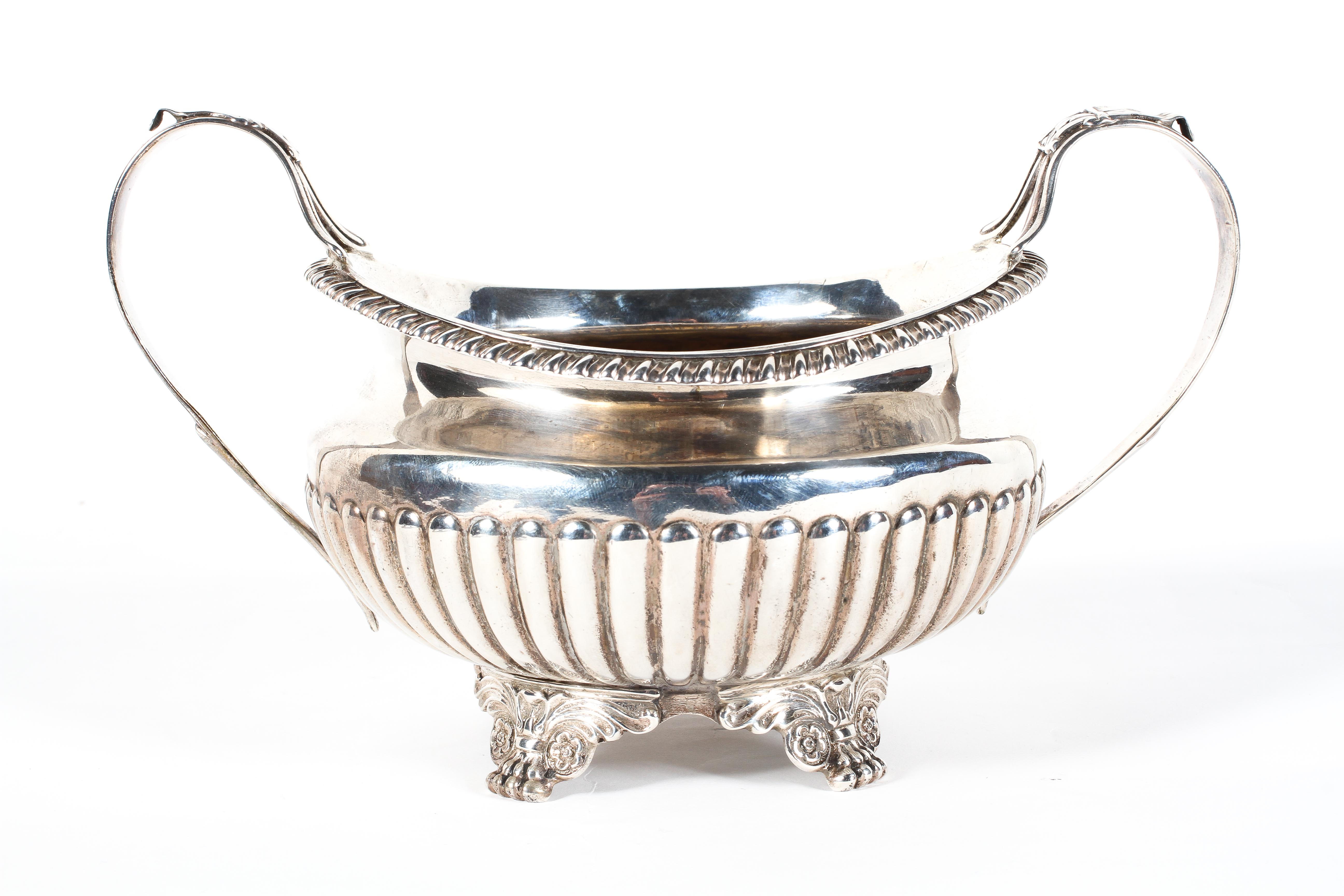 A large Georgian two handled oval sugar bowl, hallmarked for London, 1818,