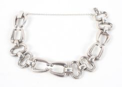 A heavy linked bracelet with push in clasp and safety chain.