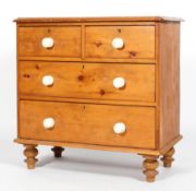A Victorian pine chest of drawers, with two short drawers above two long graduated drawers,