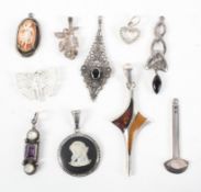 A collection of ten silver pendants of various designs. Some are marked for sterling silver 925.