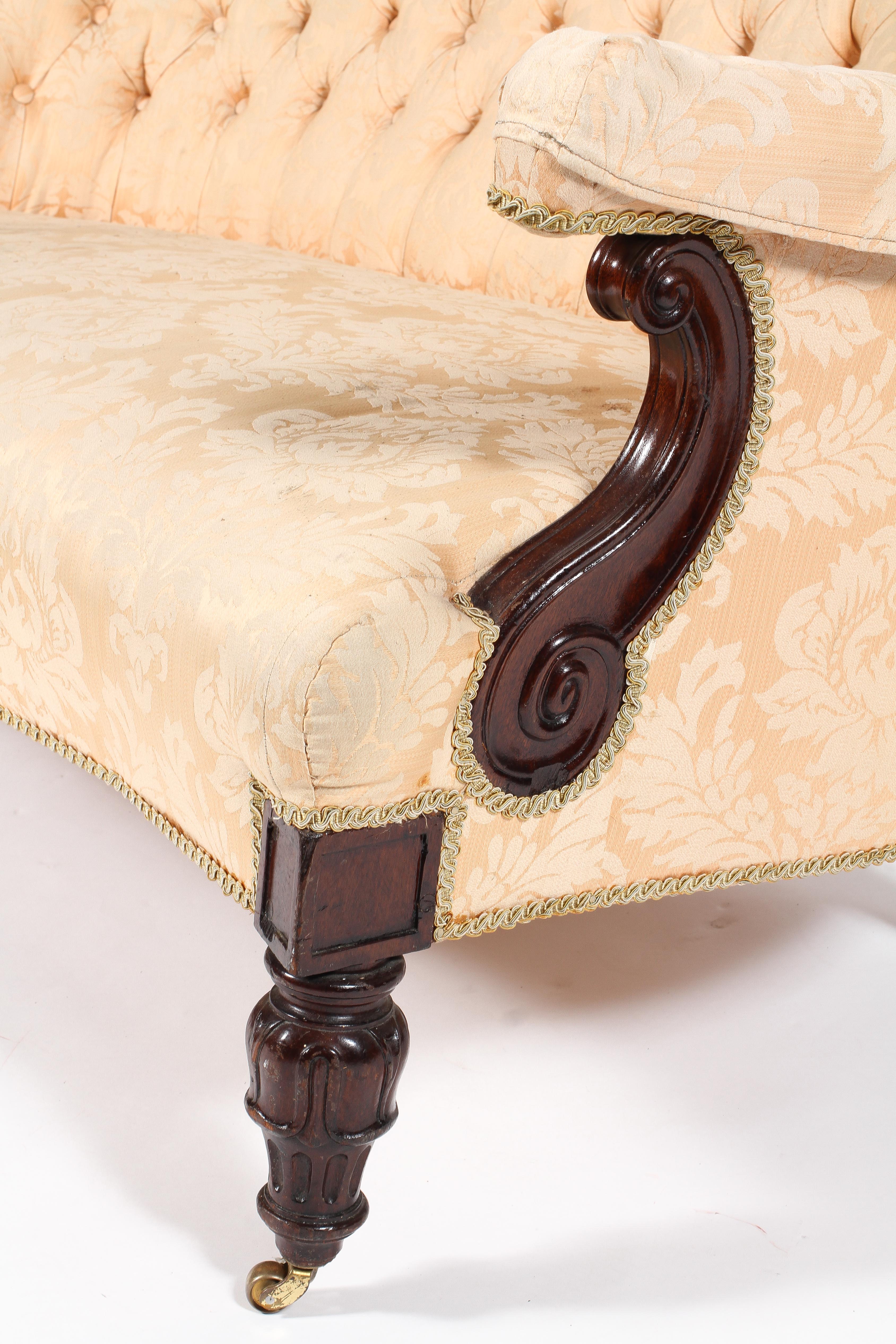 A Victorian button back settee, of serpentine form with scroll carved arms and foliate carved legs, - Image 3 of 3