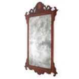 A George III mahogany marquetry wall mirror, inlaid with shell vignette,