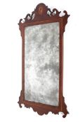 A George III mahogany marquetry wall mirror, inlaid with shell vignette,