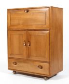 An Ercol blonde elm bureau cupboard,