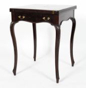 An Edwardian magohany envelope card table,