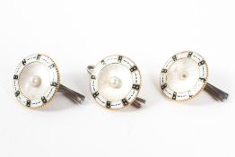 A set of three button clips each finished with mother of pearl and enamel.