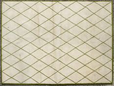 A Rug Company carpet, with a green trellis design on a cream ground,