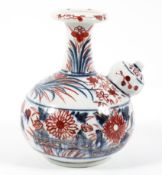 A Japanese Imari pattern Kendi, 19th century, with globular spout,