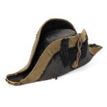 A early 19th century British Naval bicorn hat, applied with gilt brass button and silver thread,