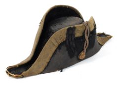 A early 19th century British Naval bicorn hat, applied with gilt brass button and silver thread,