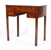 A George III mahogany desk, with freize drawer above two smaller drawers, with brass swing handles,