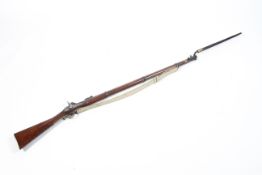 A Percussion musket with bayonet, engraved with a crowned VR/Tower 1853, with scabbard,