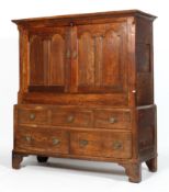 A George III oak and elm cupboard,