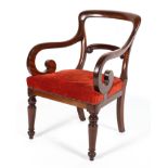 A Victorian mahogany armchair, late 19th century, with scroll carved back and arms,