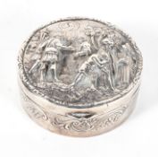 A Dutch circular box and cover, the cover embossed in high relief with Middle Eastern figures,