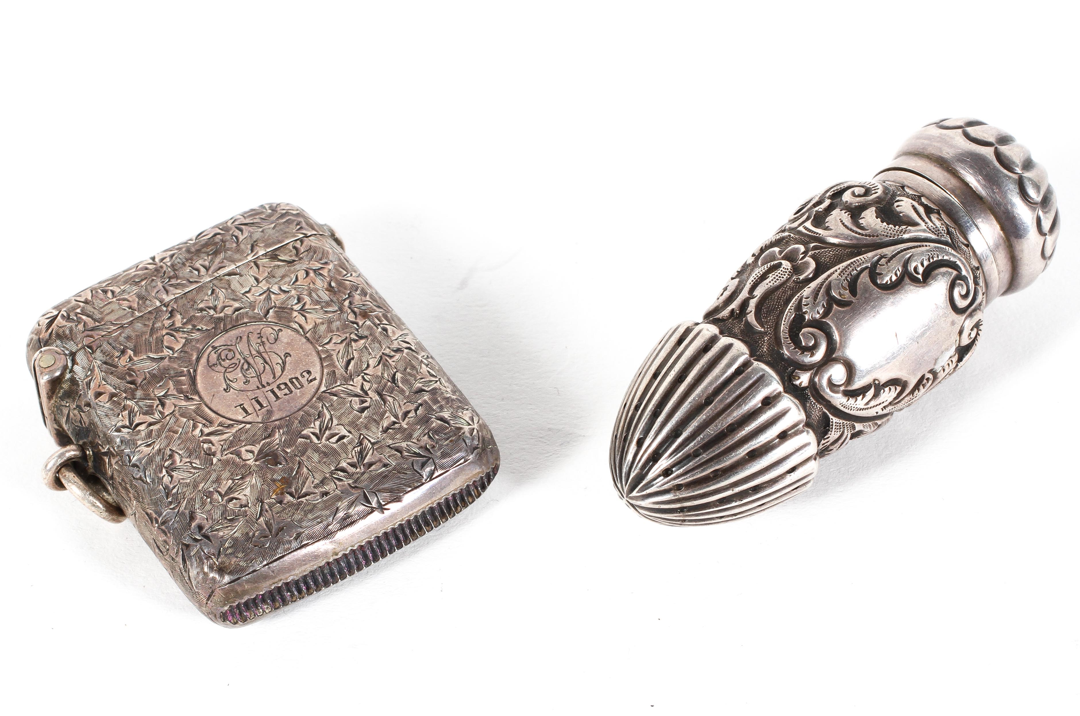 A Victorian silver scent bottle, with embossed and engraved decoration throughout, marks rubbed,