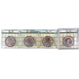 Four late 19th/early 20th century stained and leaded glass panels,