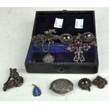 A collection of costume jewellery brooches of assorted sizes and designs,