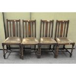 A set of four chairs on barley twist legs with green upholstery,