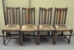 A set of four chairs on barley twist legs with green upholstery,