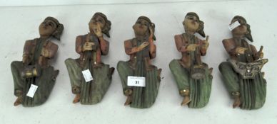Five carved wooden Eastern figures of musicians,