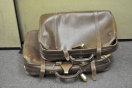 A set of retro brown leather Gucci suitcases
