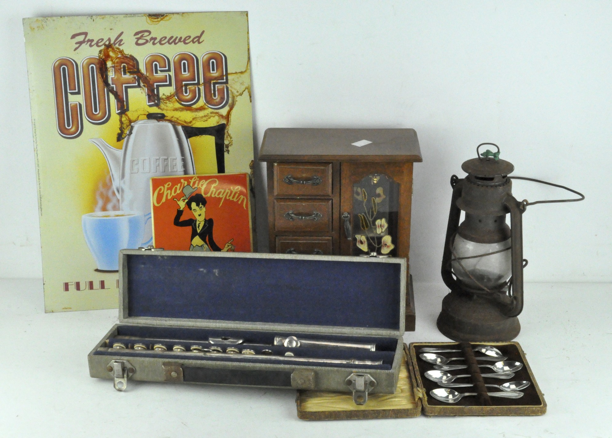 A boxed flute engraved Buisson and marked 3, together with a box of six EPNS spoons, a gas lamp,