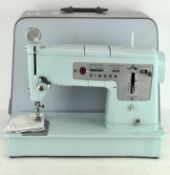 A 1960's turquoise Singer 348 sewing machine,