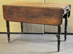 A Victorian mahogany Pembroke table, with a single drawer and drop leaf to either side,