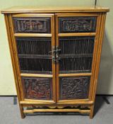 A Chinese two door cupboard, 20th century,