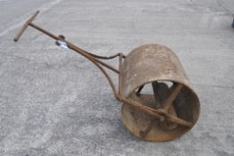 A large vintage roller, with scroll handle,