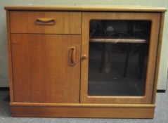 A late 1980's/early 1990's G-Plan media cabinet with one drawer above a single door