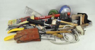 A large selection of assorted tools, including drills, secateurs and brushes,