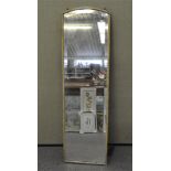 A full length wall mirror with bevelled edge,