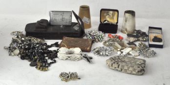 A collection of assorted costume jewellery, including brooches, medallions,