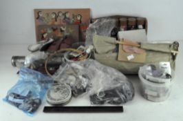 A collection of vintage sewing items, silver thimbles, Milward & Sons needle case,