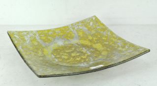 A contemporary glass dish with gold foil design, possibly a Studio example, of square form,