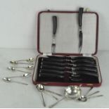 A box of horn handled knives and forks with 12 silver plate Apostle spoons and a tea strainer