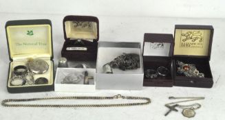 A selection of assorted silver jewellery, including a charm bracelet, rings, locket, etc