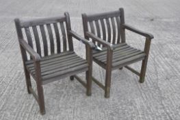 Two Alexander Rose hardwood garden chairs of slatted construction,