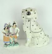 A Staffordshire dog with black spots,