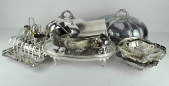 A large quantity of silver plate including two pheasants, dishes, trays, a toast rack,