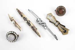 A collection of six abstract costume brooches of variable designs.