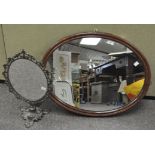A vintage oval wall mirror in a wood frame, 53 cm x 68 cm,