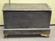 A wooden fire blanket box, painted black with hinged lid, 91cm x 60cm x 45cm,