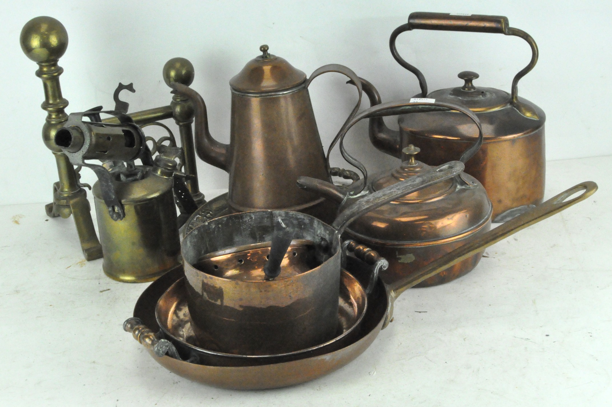 A collection of brass and copper to include a blow lamp