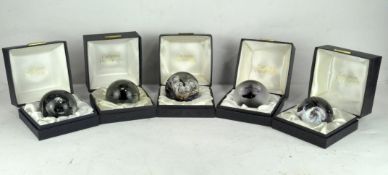 A group of five Caithness glass paperweights, including four limited editions,